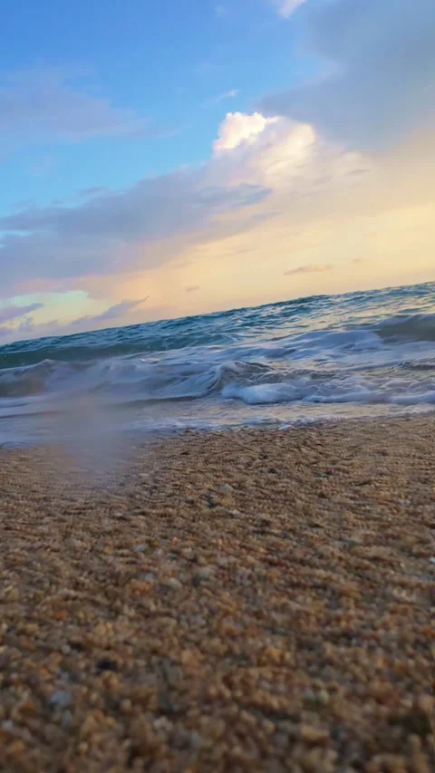 Waves Crashing on Sandy Beach at Sunset. Slow motion Stock Footage 312245615