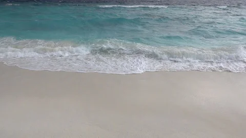 Waves crashing on sandy beach at windy day. Slow motion 240 fps Stock Footage 119150381