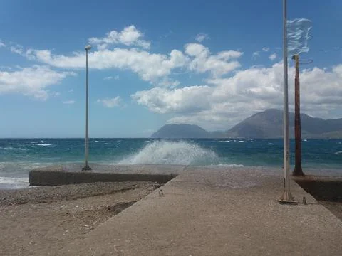 Waves crashing into seafront Stock Photos