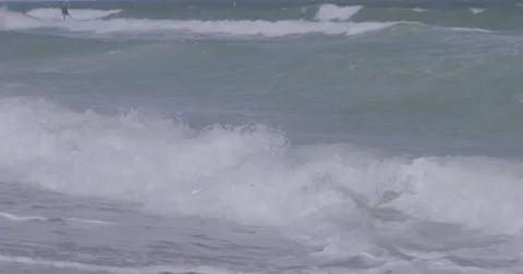 Waves crashing on seashore Stock Footage 61085510