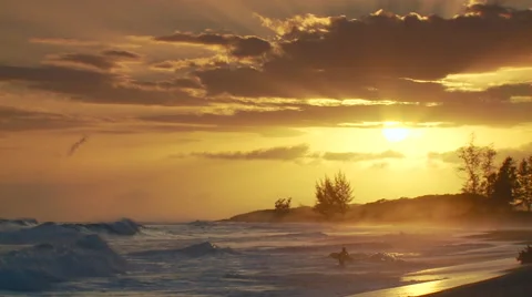 Waves crashing on seashore at sunset Stock Footage 57815111