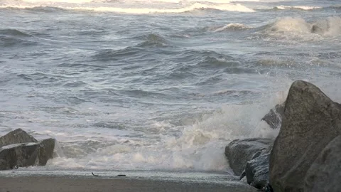 Waves crashing in to the shore Video stock 218436719
