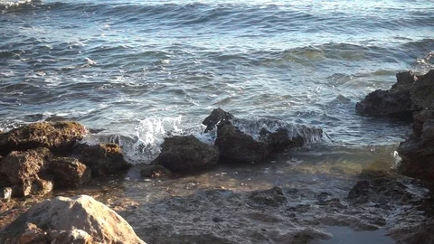 Waves crashing in slow motion against the rock Stock Footage 124472872
