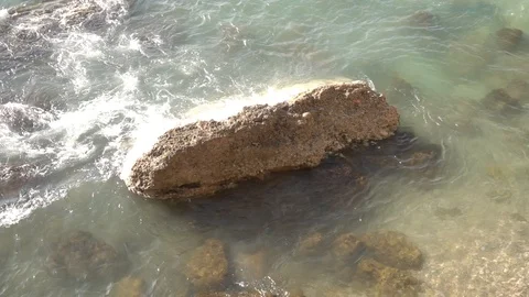 Waves crashing in slow motion against the rock Stock Footage 124691805