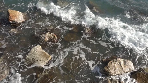 Waves crashing in slow motion against the rock Stock Footage 124691893