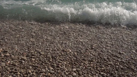 Waves crashing in slow motion against the rock Stock Footage 124692549