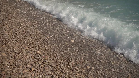 Waves crashing in slow motion against the rock Stock Footage 124692865