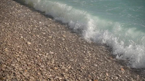 Waves crashing in slow motion against the rock Stock Footage 124693122