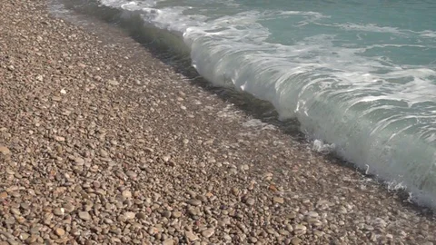 Waves crashing in slow motion against the rock Stock Footage 124693374