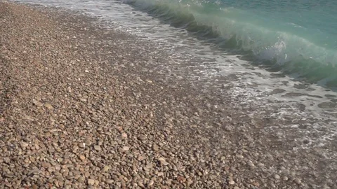 Waves crashing in slow motion against the rock Stock Footage 124693677