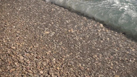 Waves crashing in slow motion against the rock Stock Footage 124694081