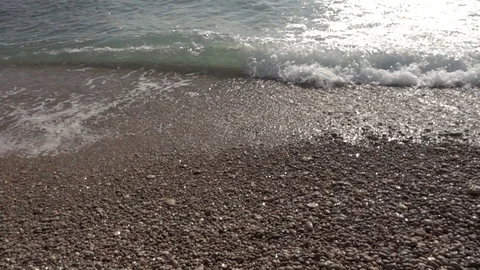 Waves crashing in slow motion against the rock Stock Footage 124694351