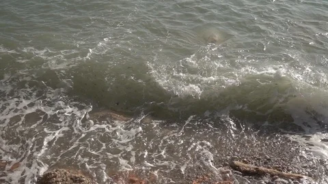 Waves crashing in slow motion against the rock Stock Footage 124695637