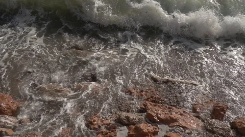Waves crashing in slow motion against the rock Stock Footage 124696186