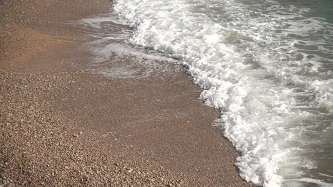 Waves crashing in slow motion against the rock Stock Footage 124696337