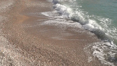 Waves crashing in slow motion against the rock Stock Footage 124696638