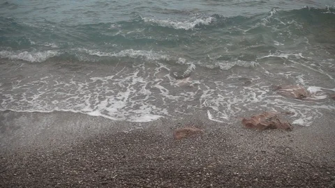 Waves crashing in slow motion against the rock Stock Footage 125095129