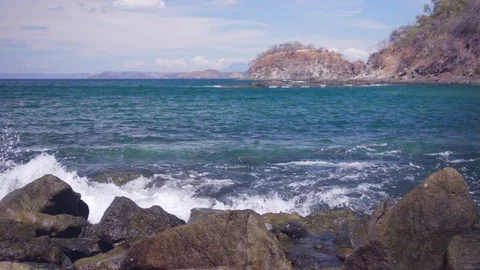 Waves crashing in slow motion onto the ocean shoreline Stock Footage 103217355