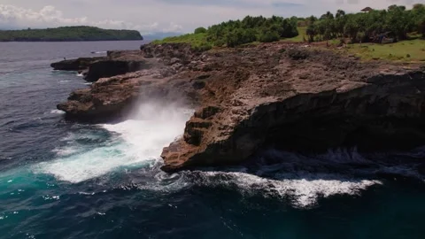 Waves Crashing at Smoke Beach Cliffs, Nusa Penida Stock Footage 313593690