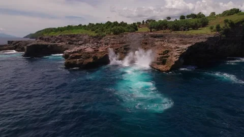 Waves Crashing at Smoke Beach Cliffs, Nusa Penida Stock Footage 313593744