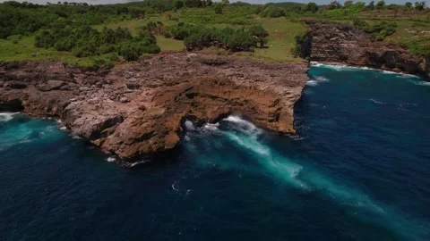 Waves Crashing at Smoke Beach Cliffs, Nusa Penida Stock Footage 313593788