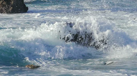 Waves Crashing on Stone Beach Stock Footage 45701638