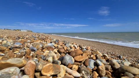 Waves crashing onto a stone beach Stock Footage 144322405