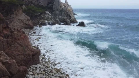Waves crashing on a stones beach, sea fixed view Stock Footage 160552425