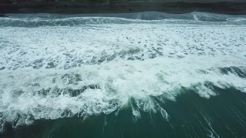 Waves crashing into surfers Stock Footage 95192282
