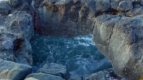 Waves crashing through cave close Kauai Hawaii Stock Footage 81946974