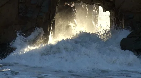 Waves crashing through cave Stock Footage 43223149