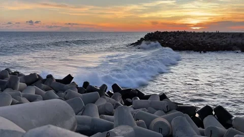 Waves crashing through concrete wave breaker. Stock Footage 307813499