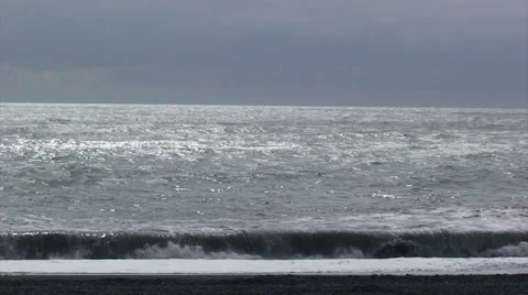 Waves crashing on volcanic beach Stock Footage 37581291