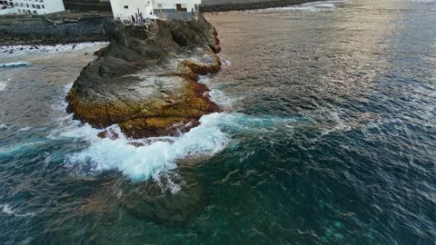 Waves Crashing on a Volcanic Sea Stack in Gran Canaria, Spain Stock Footage 346429779