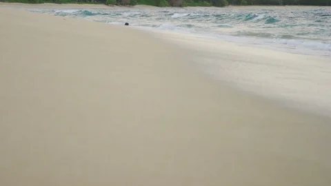 Waves crashing on white sandy beach Stock Footage 105932202