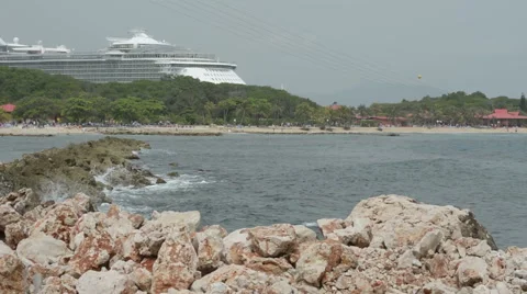 Waves Crashing Zip Liners and Cruise Ship Stock Footage 46624107