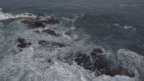 WAVES CRASHING|AERIAL, SLOW OVERHEAD, EXT, TRACKING RIGHT|2398|4K Stock Footage 105028233