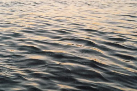 Waves creating a soothing and rhythmic pattern. Stock Photos