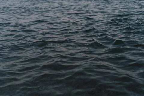 Waves creating a soothing and rhythmic pattern. Stock Photos