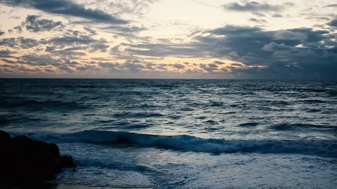 Waves crest along the florida shore during a beautiful morning sunrise Stock Footage 89242035
