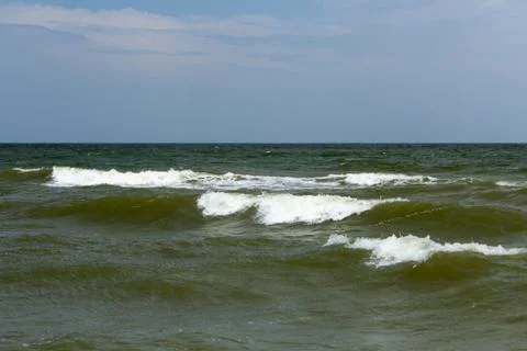 Waves with crests on the surface of the sea Stock Photos