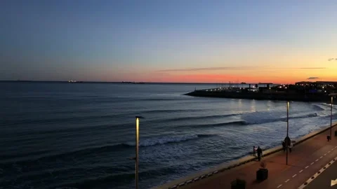 Waves crushing on the beach during sunset in Tarragona Stock Footage 148548011