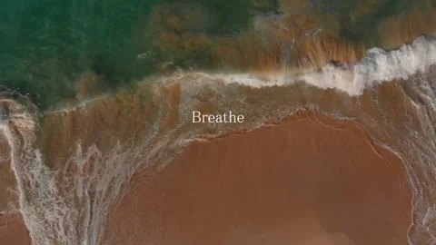 Waves crushing down top view with the Breathe word Video stock 149458023