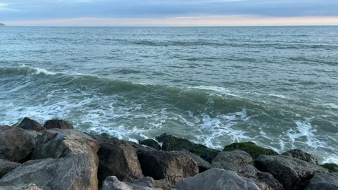 Waves crushing on large stones Stock Footage 212467555