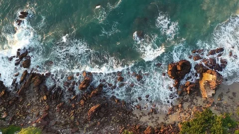 Waves crushing on rocks on the beach in Mexico. Static drone footage. Beach seen Stock Footage 120939307