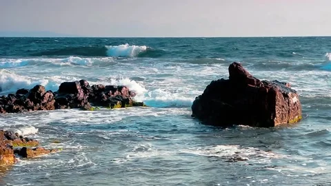 Waves crushing rocks on the coast Stock Footage 130552128