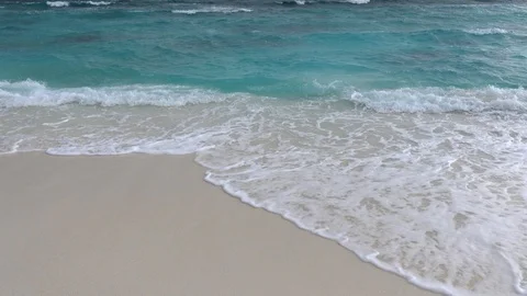 Waves crushing on sandy beach. Stormy turquoise water. 4K Video stock 119156759