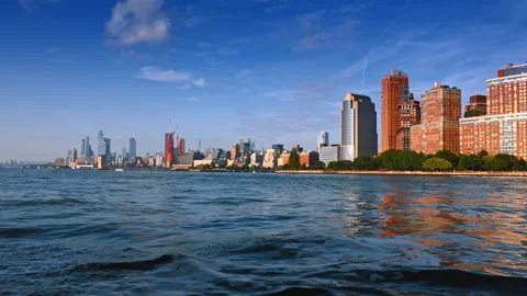 Waves on the dark waterscape of the river in New York, USA. Metropolis skyline Stock Footage 316556221