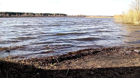 Waves on a deep river in spring Video stock 109288971