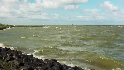 Waves on the dike of Hindeloopen Stock Footage 95045033